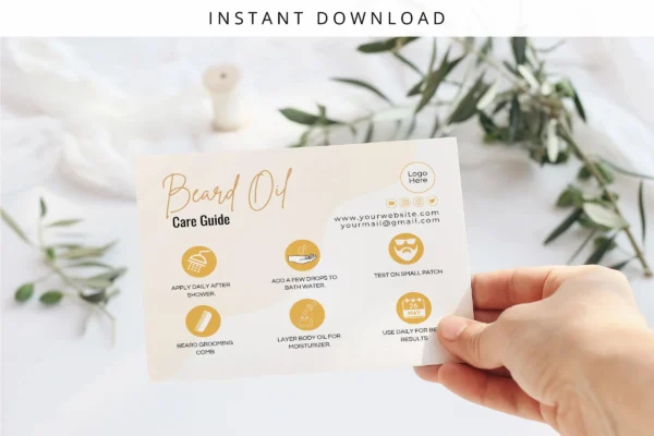 A hand holding a printed beard oil care guide with a minimalist and elegant design, featuring gold icons and text against a soft background with green leaves.