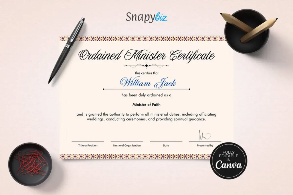 A neatly arranged ordained minister certificate with a white background, along with a black pen and a bowl of red paper clips.